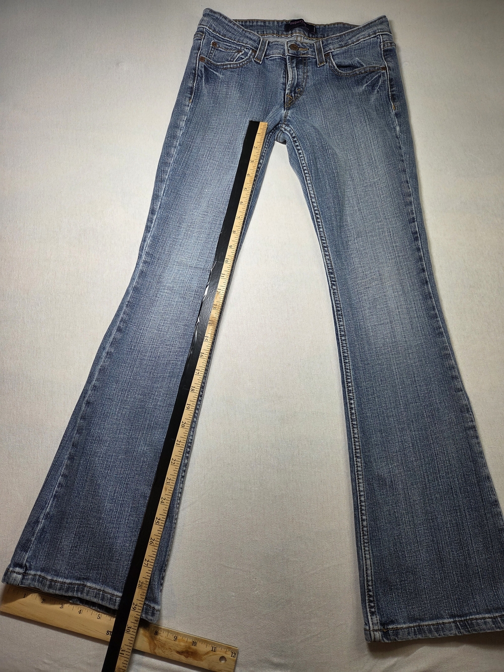 Levi's 518 Superlow low-rise denim jeans in a medium blue wash Size M